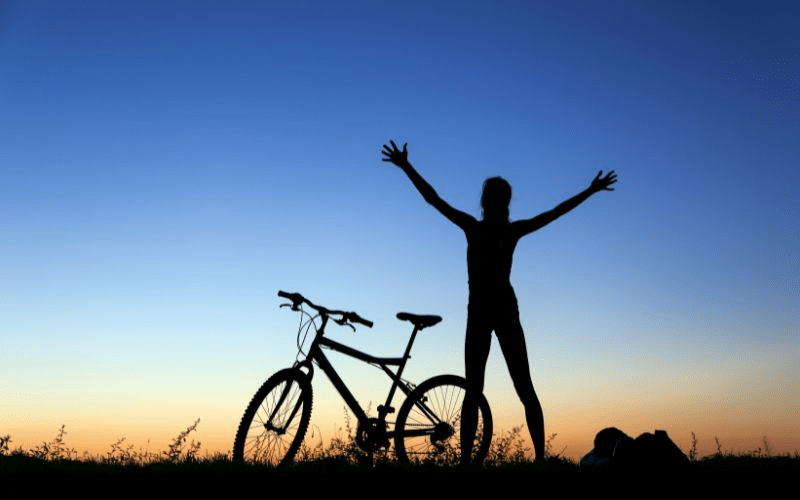 person relaxing with bike