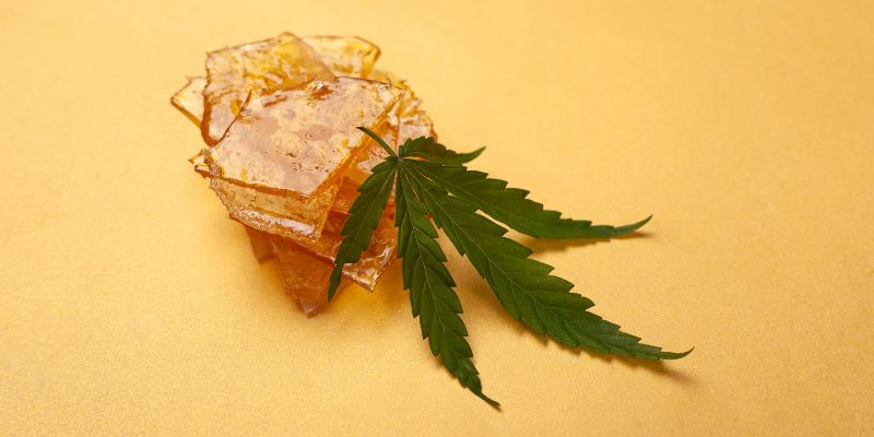 cannabis leaf and distillate
