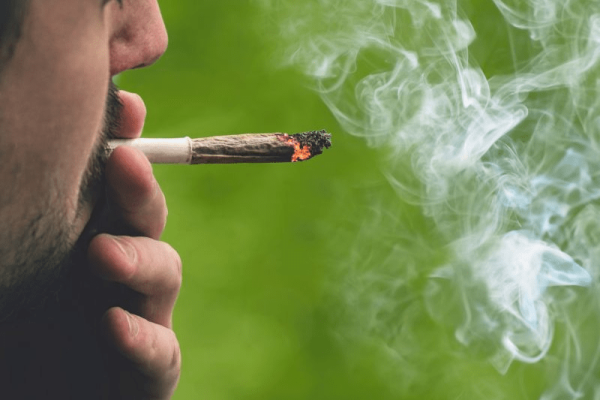 man smoking a joint